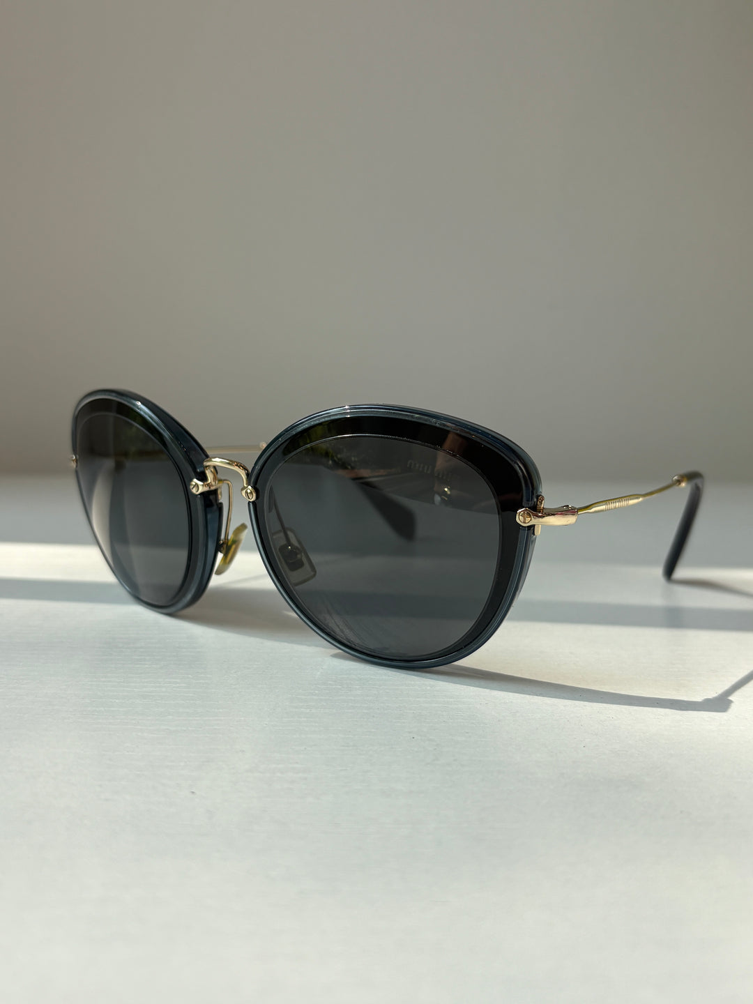 Miu Miu Black and Grey Round Sunglasses