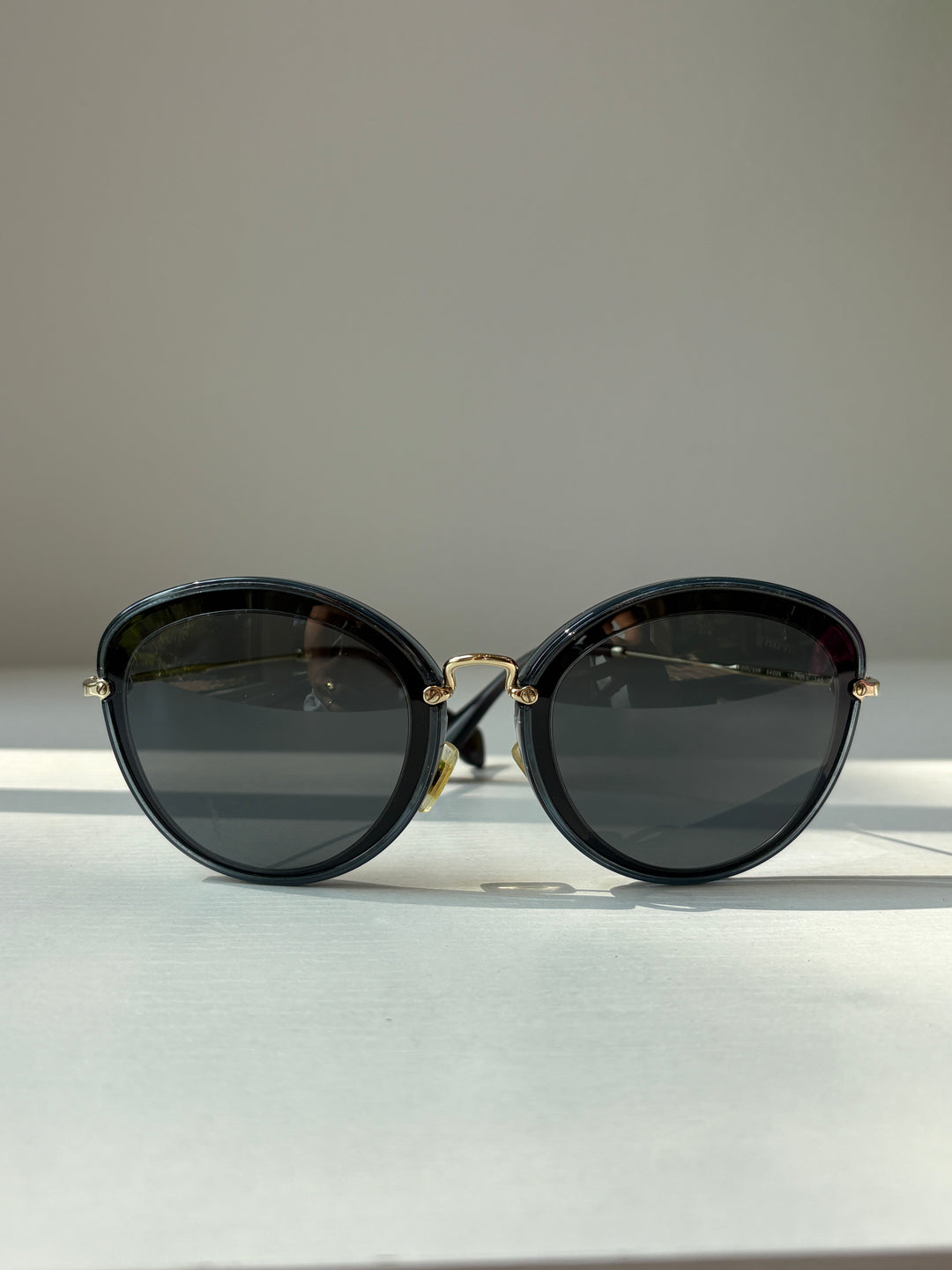 Miu Miu Black and Grey Round Sunglasses