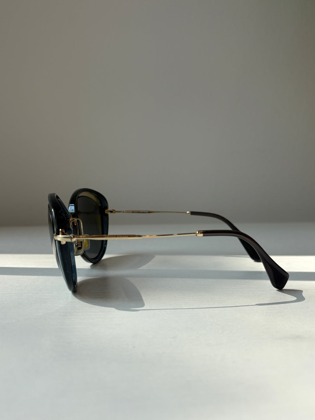 Miu Miu Black and Grey Round Sunglasses